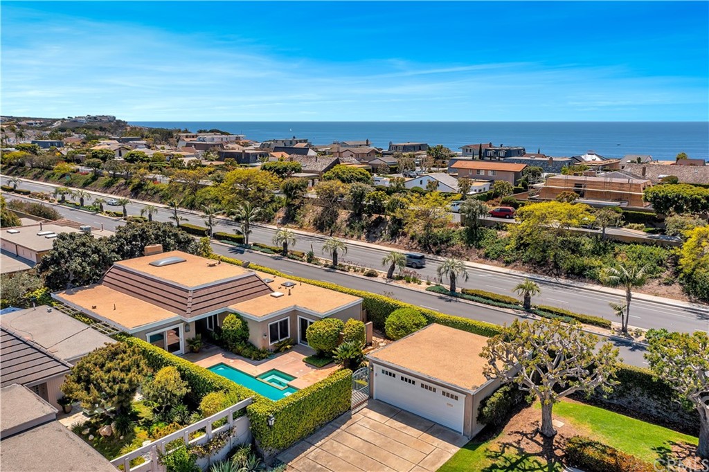23802 Cassandra Bay Dana Point, CA 92629 - Photo 3 of 48 an aerial view of a building with swimming pool and ocean view