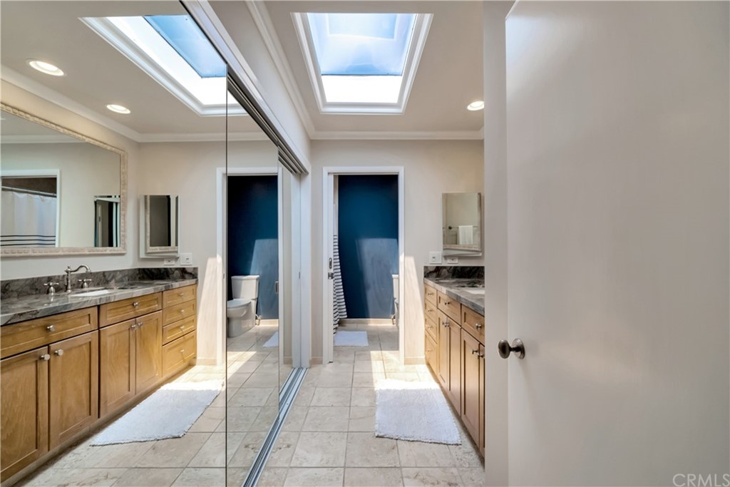 23802 Cassandra Bay Dana Point, CA 92629 - Photo 33 of 48 a bathroom with a sink a mirror and a bathtub