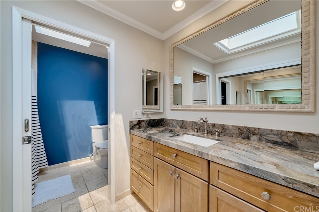 23802 Cassandra Bay Dana Point, CA 92629 - Photo 34 of 48 a bathroom with a granite countertop sink and a mirror