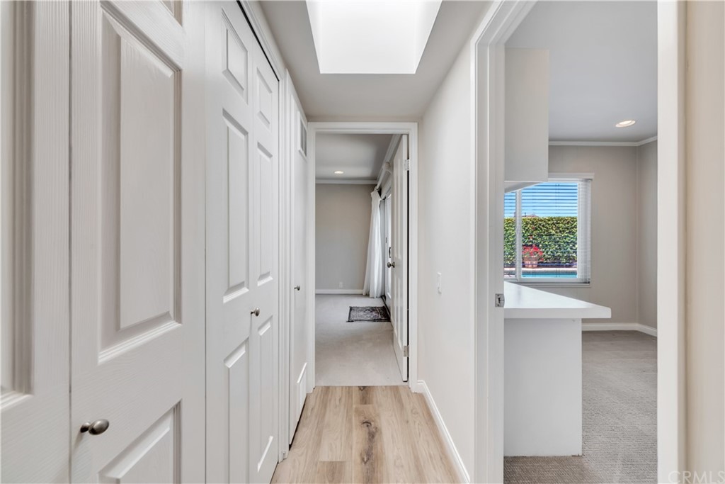 23802 Cassandra Bay Dana Point, CA 92629 - Photo 39 of 48 a view of a hallway with wooden floor and closet