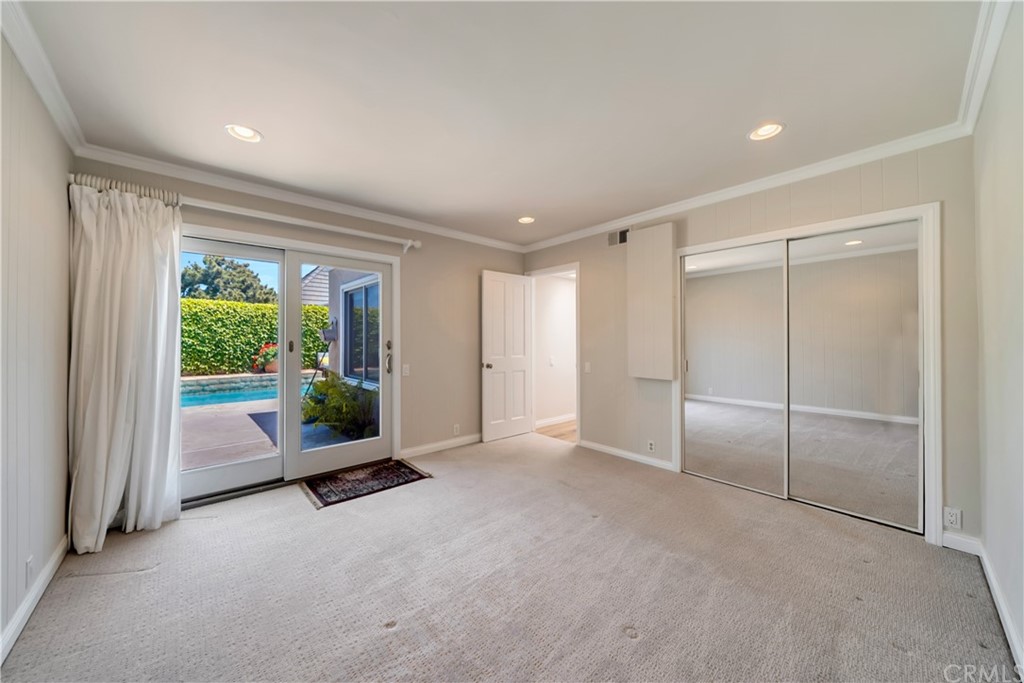 23802 Cassandra Bay Dana Point, CA 92629 - Photo 42 of 48 an empty room with floor to ceiling windows and floor to ceiling window