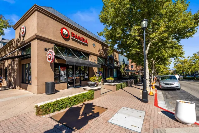 a view of a street with sitting area