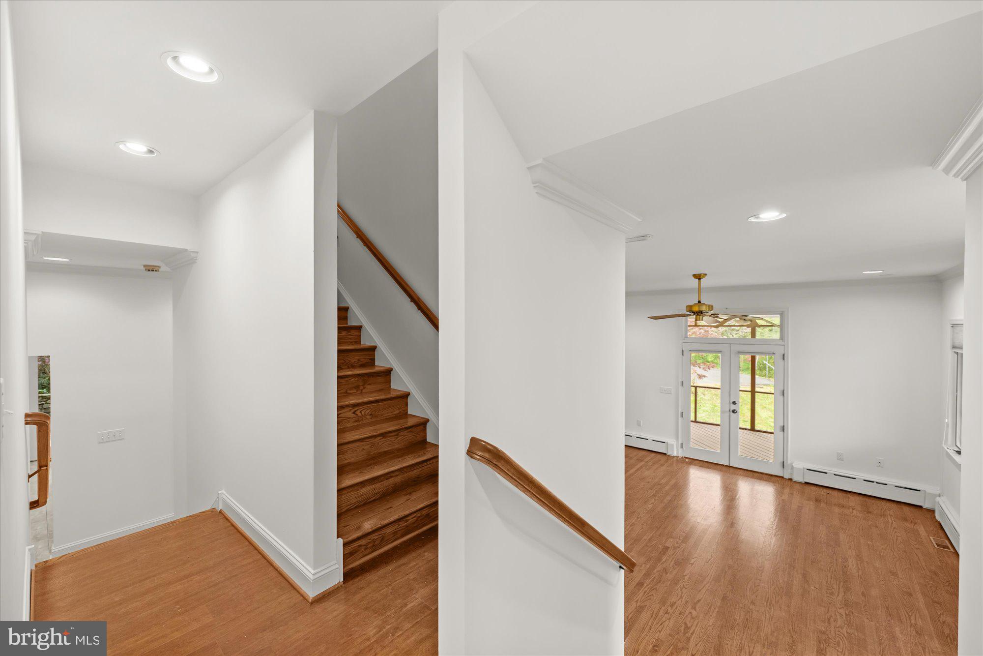 6013 Selvyn Road Bethesda, MD 20817 - Photo 21 of 54 Stairs to upper level; view of living room