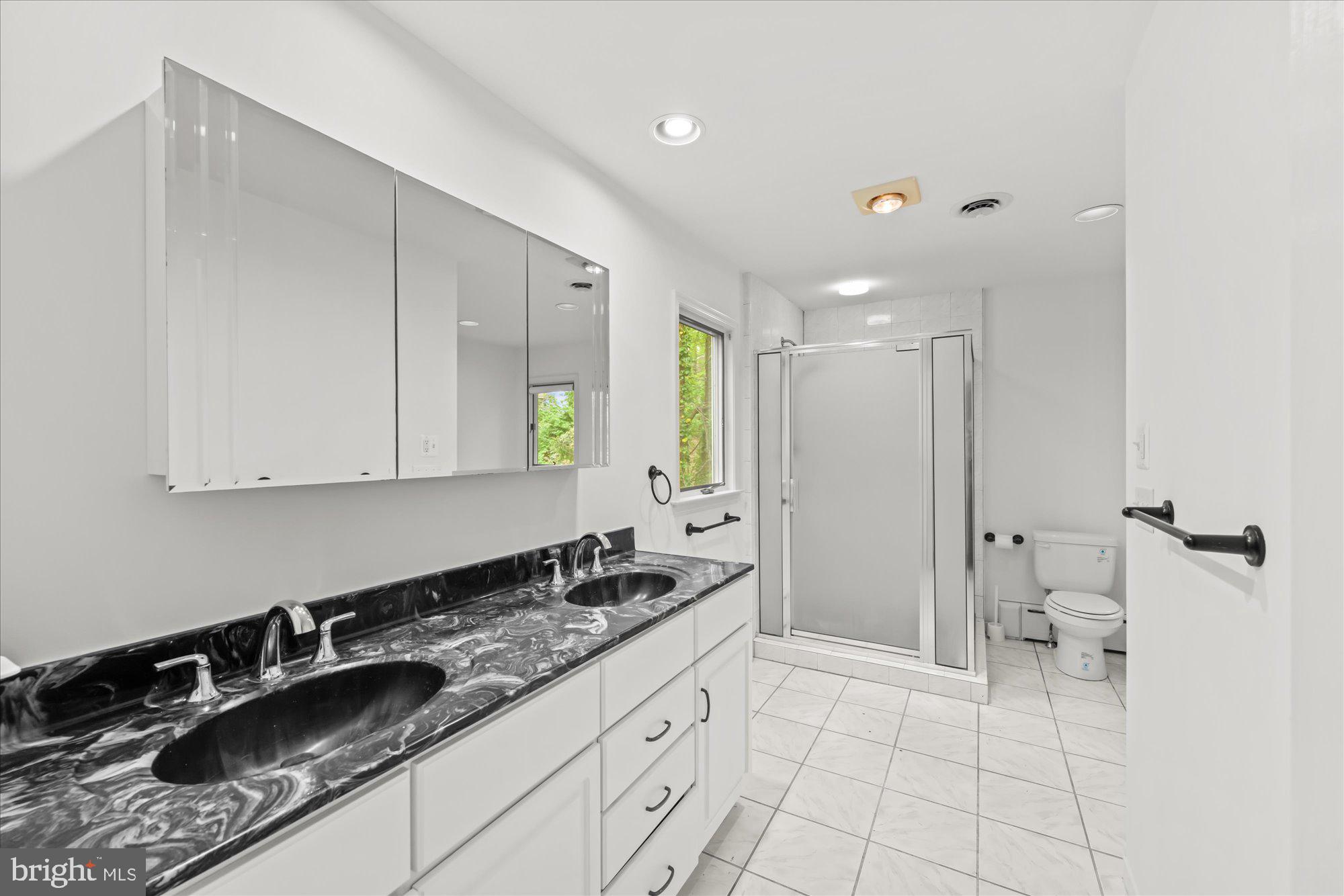 6013 Selvyn Road Bethesda, MD 20817 - Photo 28 of 54 Primary bath with double sink vanity & shower