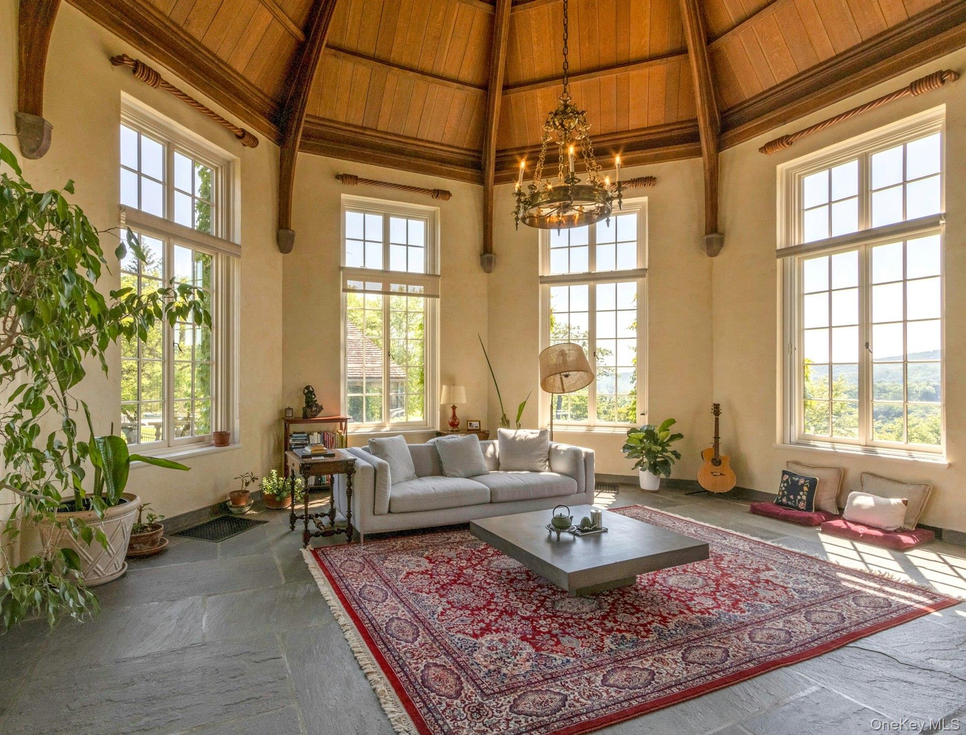 120 Ridge Road Tuxedo Park, NY 10987 - Photo 10 of 50 Living area with a chandelier, high vaulted ceiling, a wooden ceiling with exposed beams, and healthy amount of natural light
