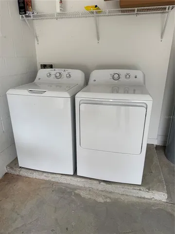 a view of a house with swimming pool and porch