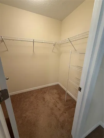 a view of a room with racks on the wall