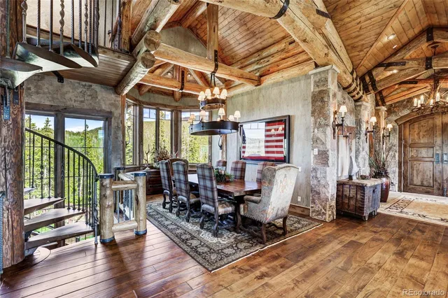 a dining table with chairs and wooden floor
