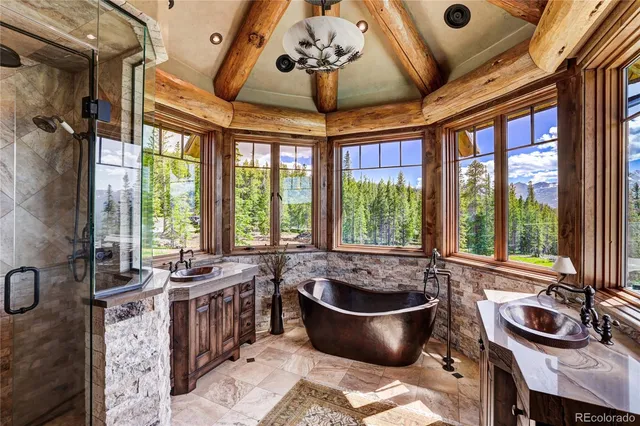 a bathroom with a shower a toilet and a shower