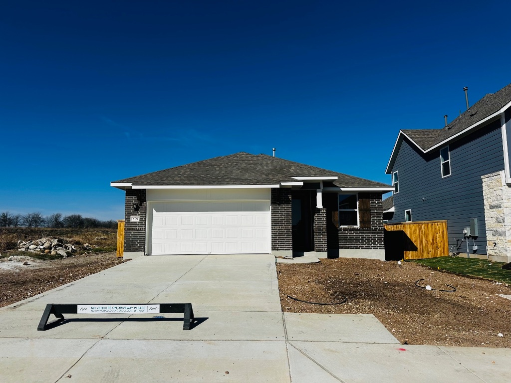 a view of a house with backyard space