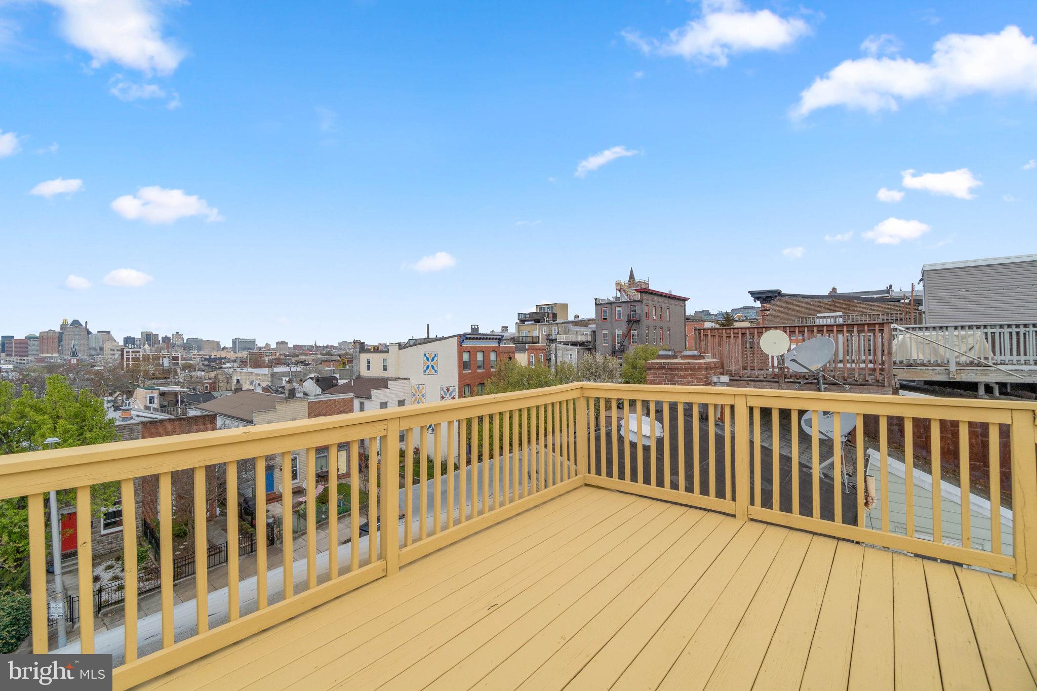 219 South Washington Street Baltimore, MD 21231 - Photo 4 of 5 a view of a balcony with wooden floor