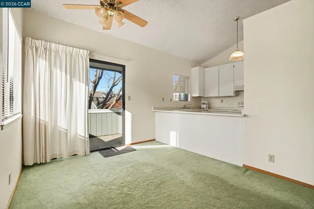 a view of kitchen with wooden floor and window