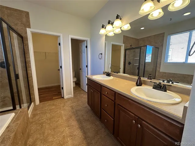a spacious bathroom with a double vanity sink double vanity and a mirror