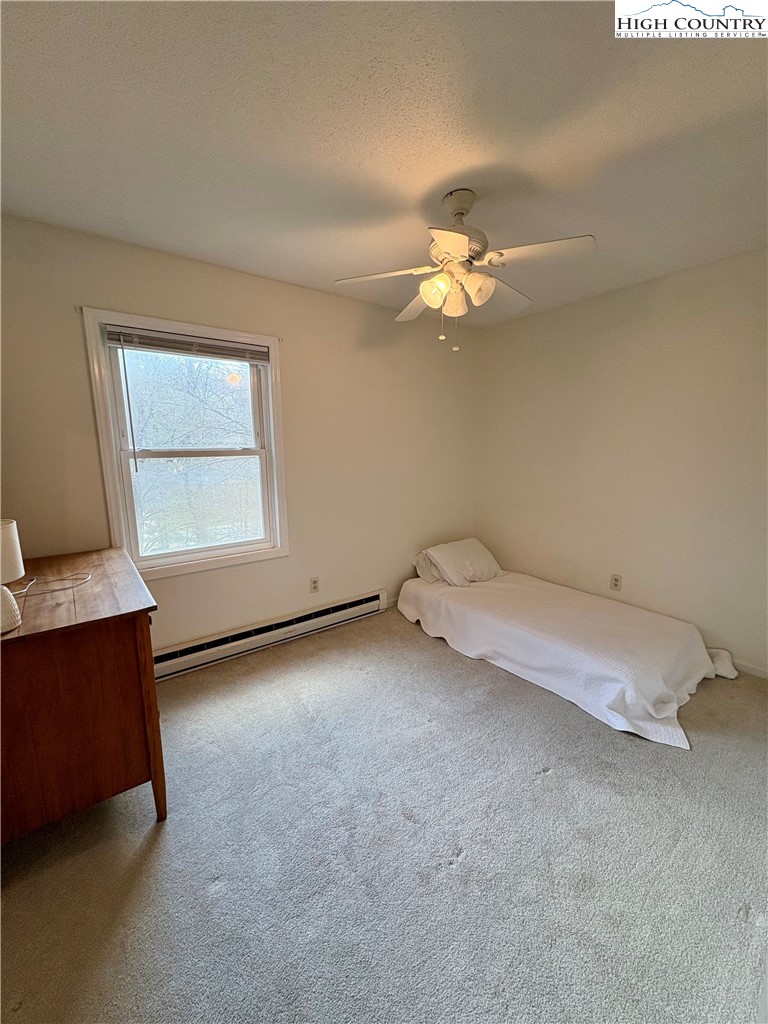 5416 Bamboo Road Boone, NC 28607 - Photo 18 of 35 an empty room with windows and fan