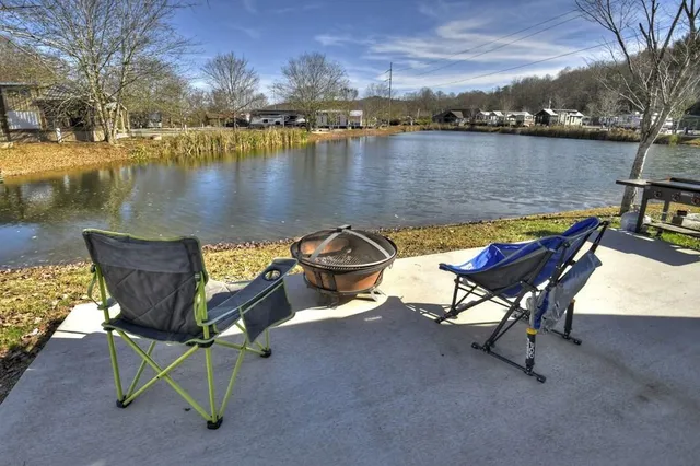 a view of a lake with outdoor seating