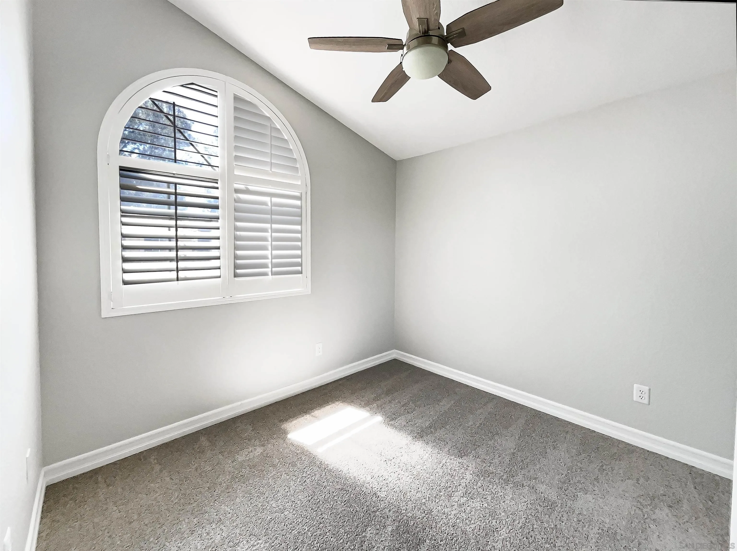 7922 Sunset Terrace Lemon Grove, CA 91945 - Photo 16 of 22 an empty room with a window and a fan