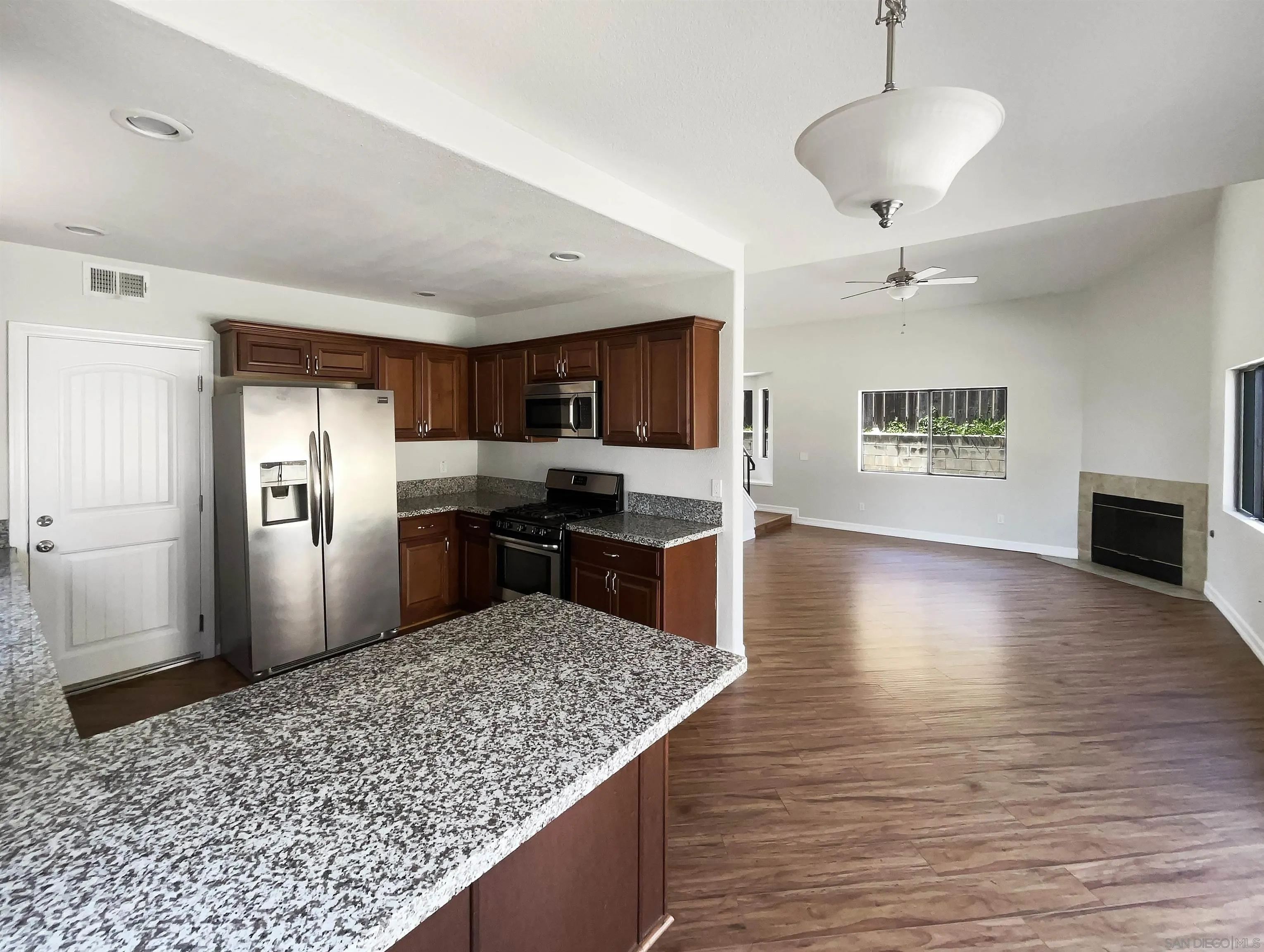7922 Sunset Terrace Lemon Grove, CA 91945 - Photo 10 of 22 a kitchen with stainless steel appliances granite countertop a sink refrigerator stove and oven