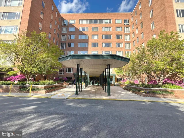 a view of a building with sitting area