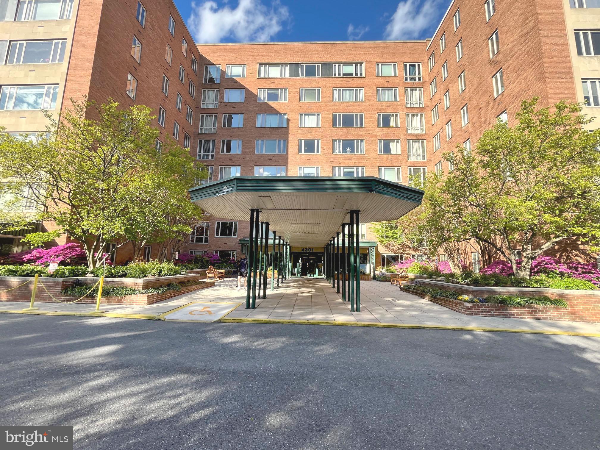 a view of a building with sitting area