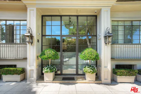 a front view of a house having outdoor seating
