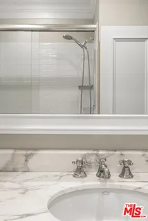 a bathroom with a bathtub and shower