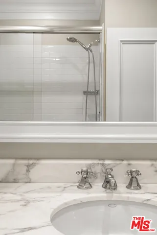 a bathroom with a bathtub and shower