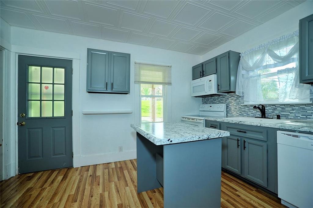 862 Candor Road Bulger, PA 15019 - Photo 8 of 19 a kitchen with a sink stove and cabinets