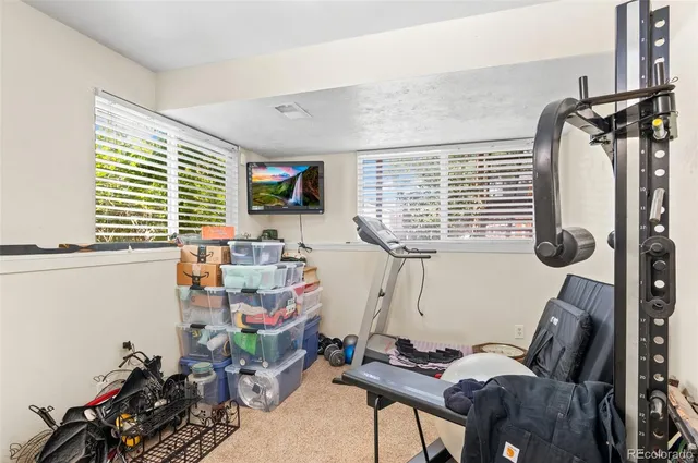 a bathroom with a sink toilet and a mirror