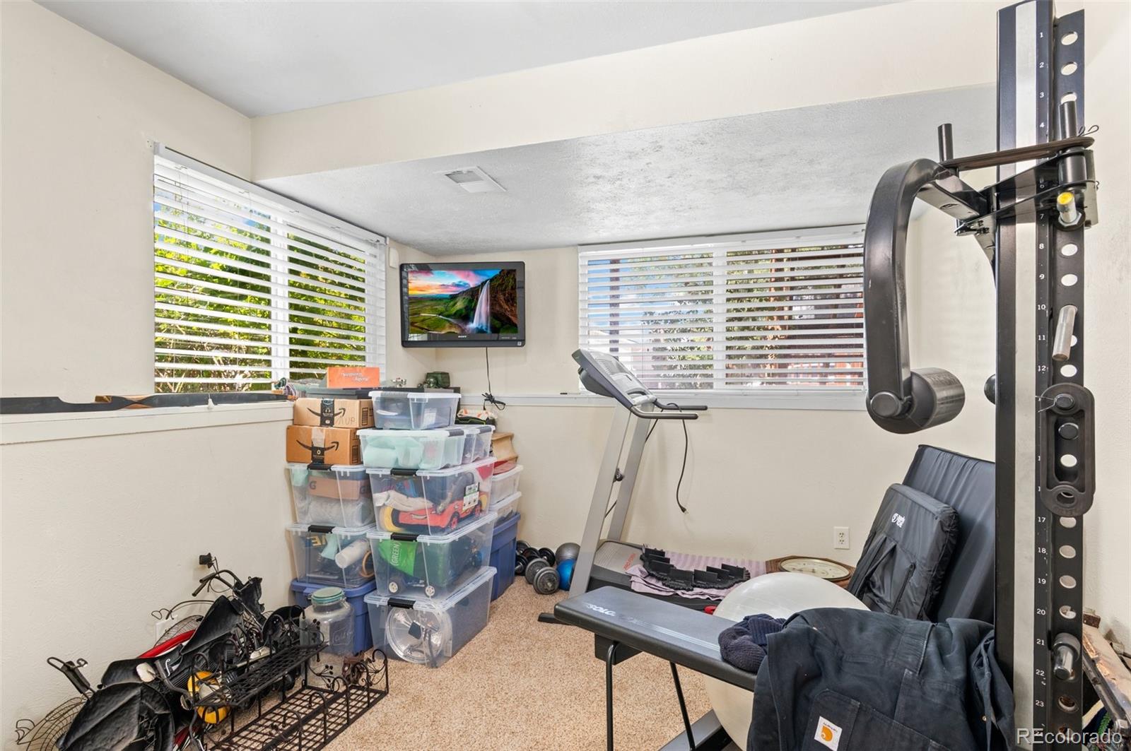 9648 Lane Street Thornton, CO 80260 - Photo 18 of 27 a view of a room with gym equipment