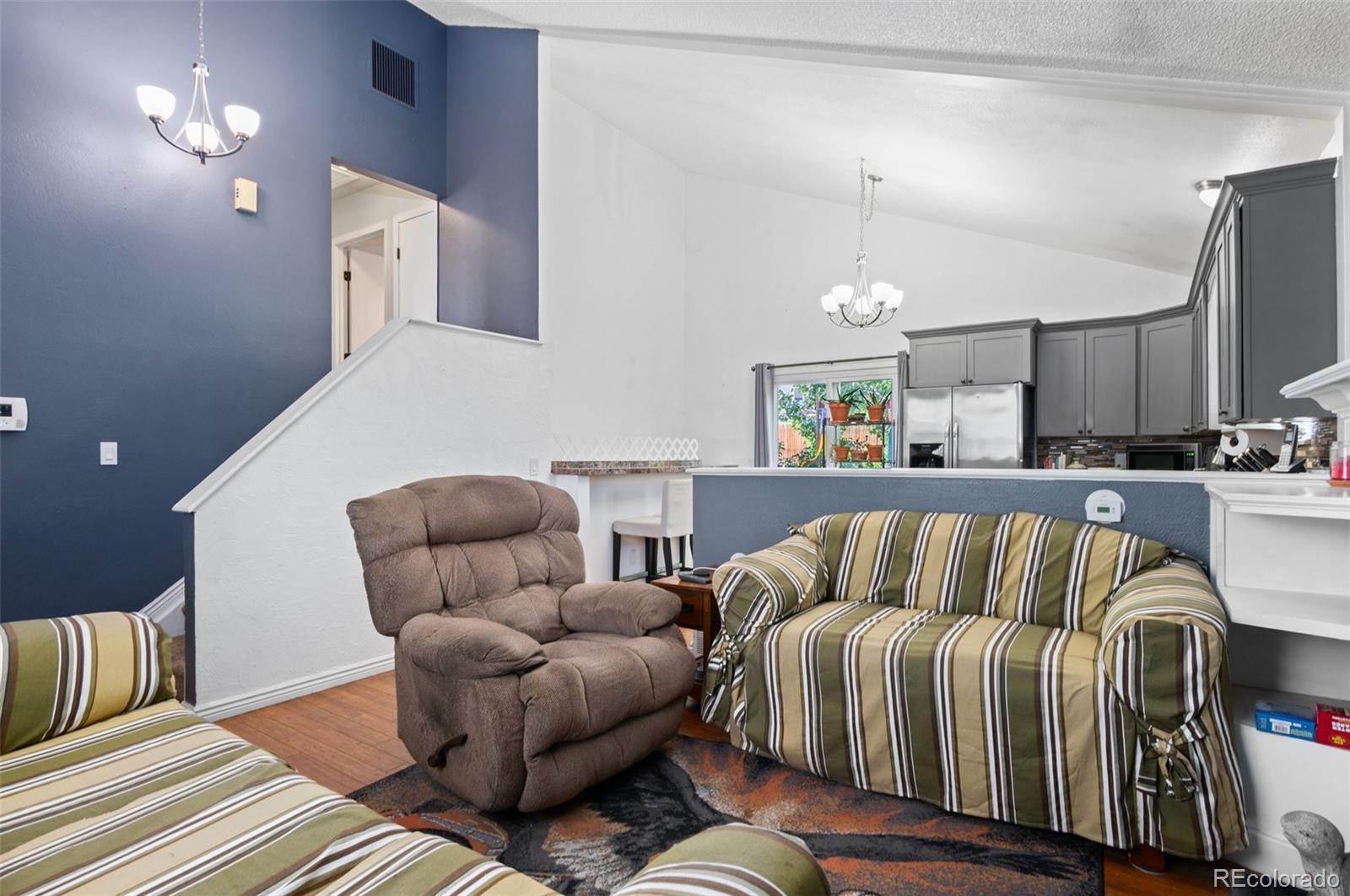 9648 Lane Street Thornton, CO 80260 - Photo 6 of 27 a living room with furniture