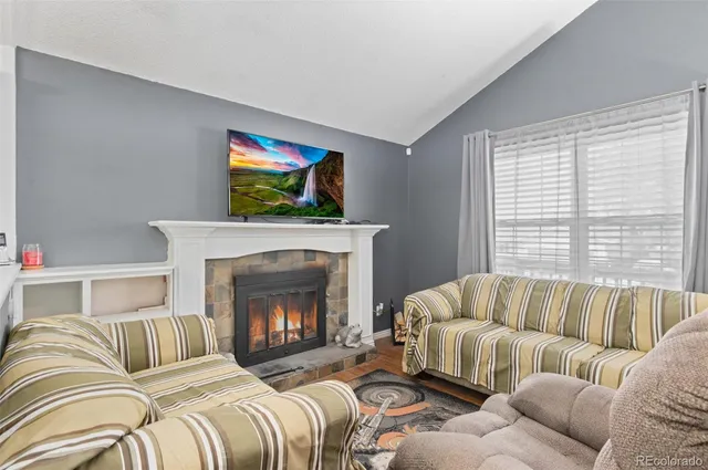 a bedroom with a bed and a fireplace