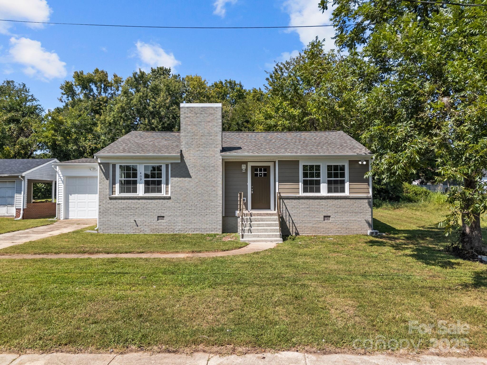 409 Shaver Street Salisbury, NC 28144 - Photo 2 of 39 a view of a yard in front of a house