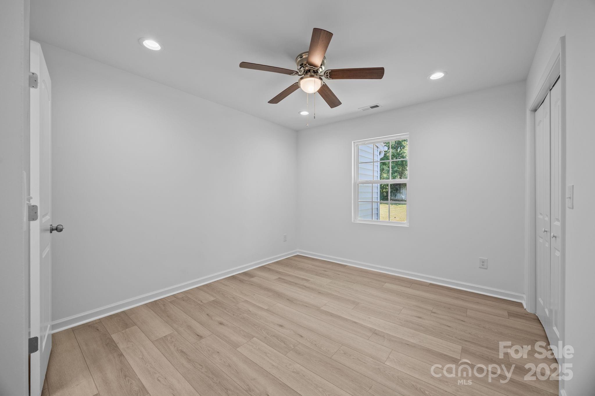 409 Shaver Street Salisbury, NC 28144 - Photo 25 of 39 wooden floor in an empty room with a window