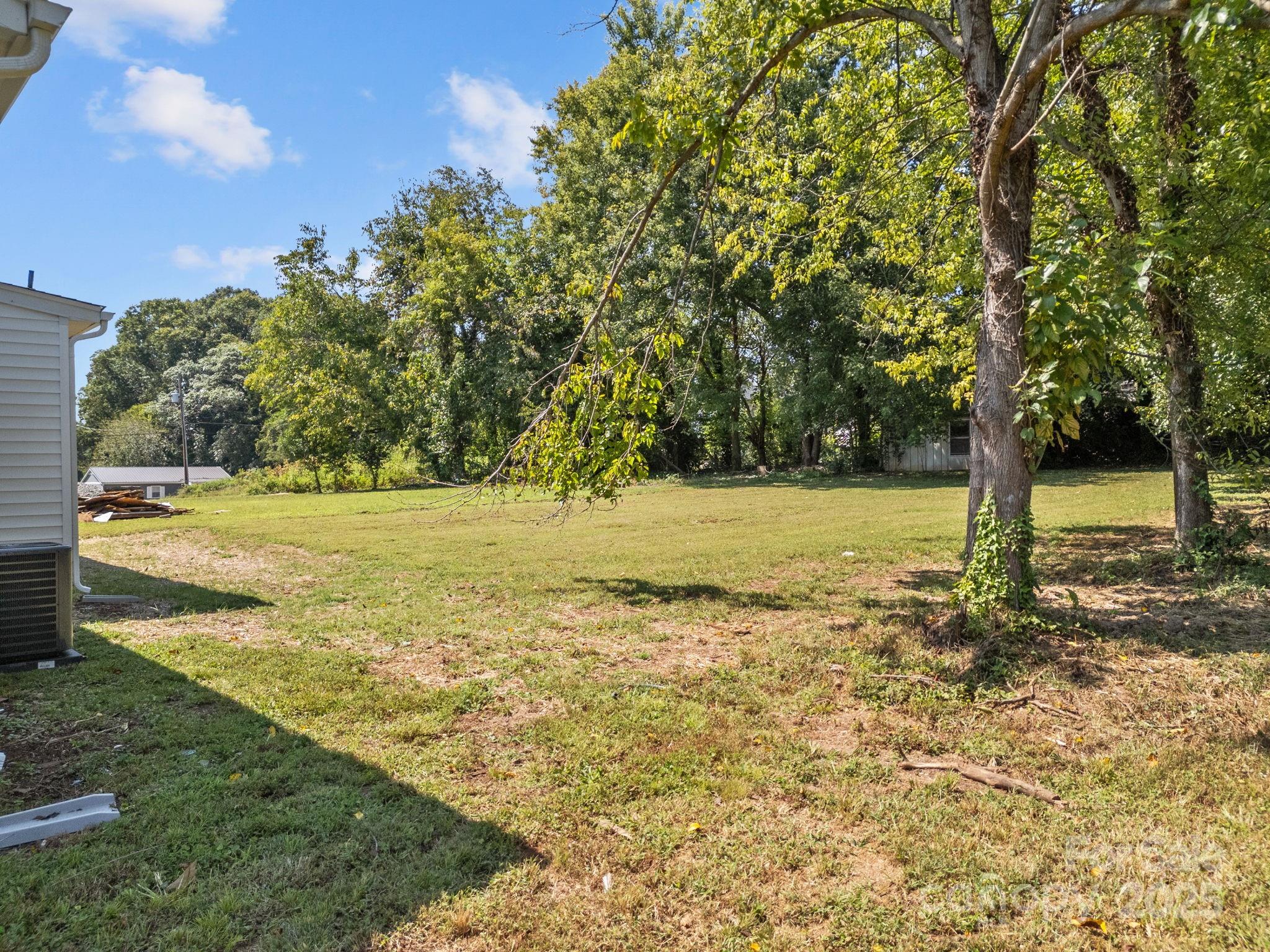 409 Shaver Street Salisbury, NC 28144 - Photo 28 of 39 a view of a yard with wooden fence