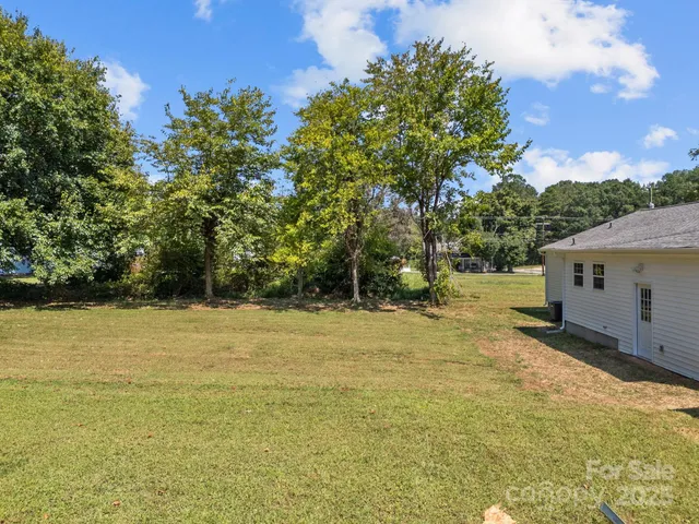 a backyard of a house with lots of green space