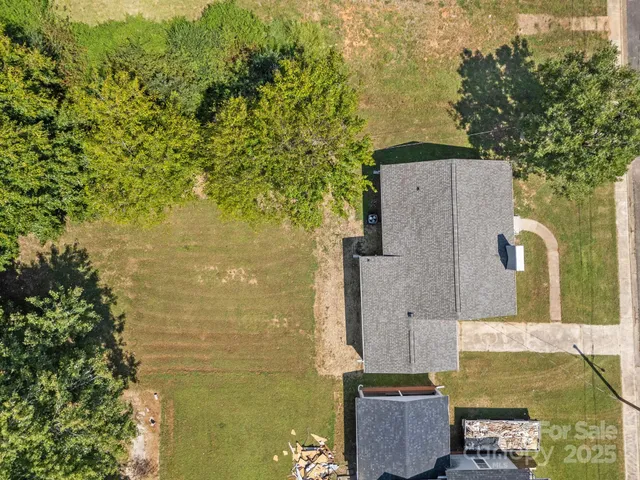 aerial view of a house with a yard