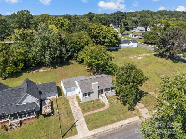 a view of an chairs and table in the patio