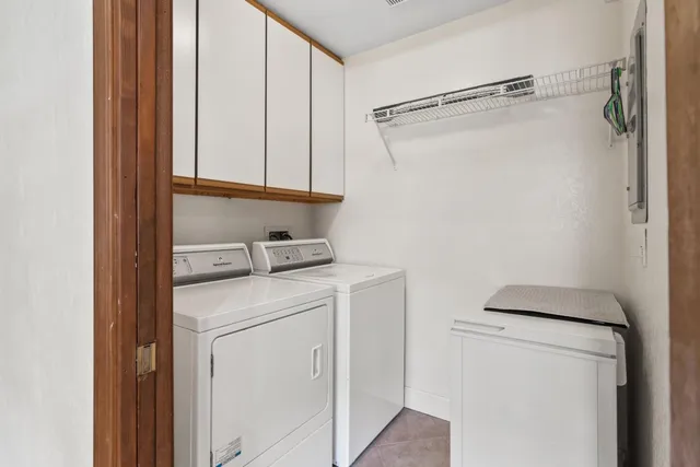 a room with a wooden floor and shelf