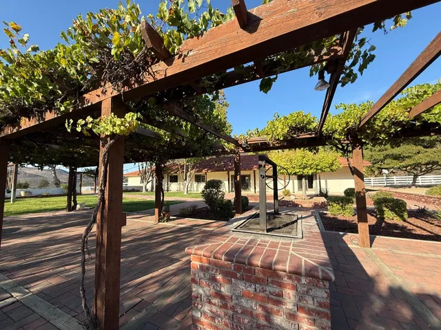 a view of a swimming pool with a patio