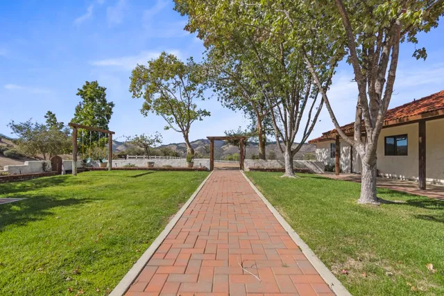 a view of a garden with a lake view