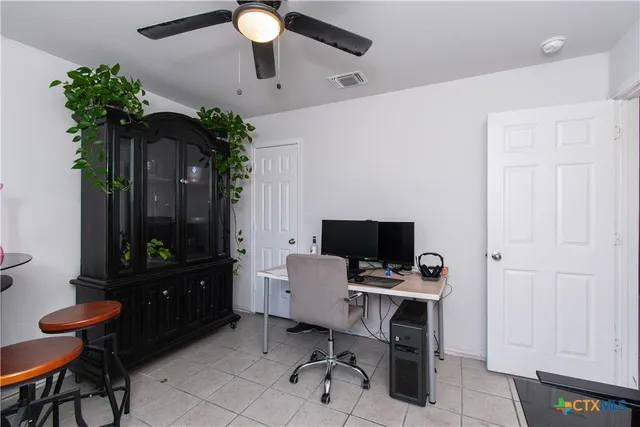 a view of a workspace with furniture