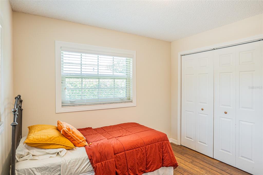 741 Brookside Road Maitland, FL 32751 - Photo 32 of 43 a bedroom with a bed and a window