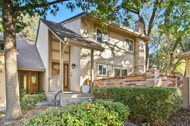 a front view of a building with a yard