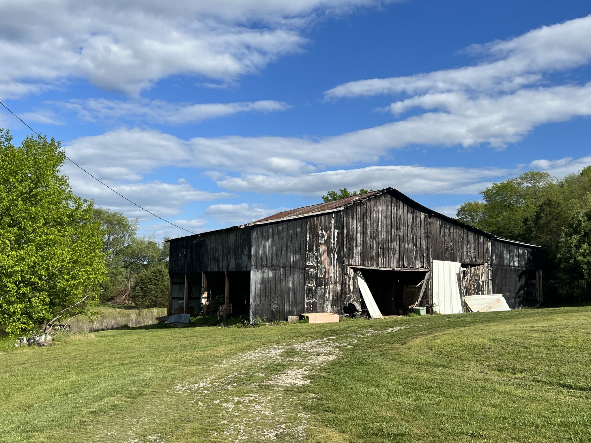 301 Lear Road Portland, TN 37148 - Photo 17 of 19 a front view of house with an outdoor space and seating