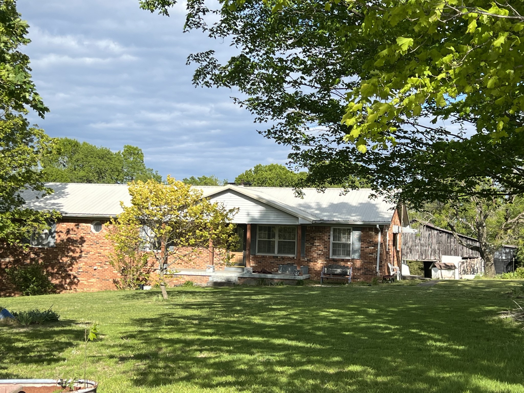 301 Lear Road Portland, TN 37148 - Photo 18 of 19 a front view of a house with a garden