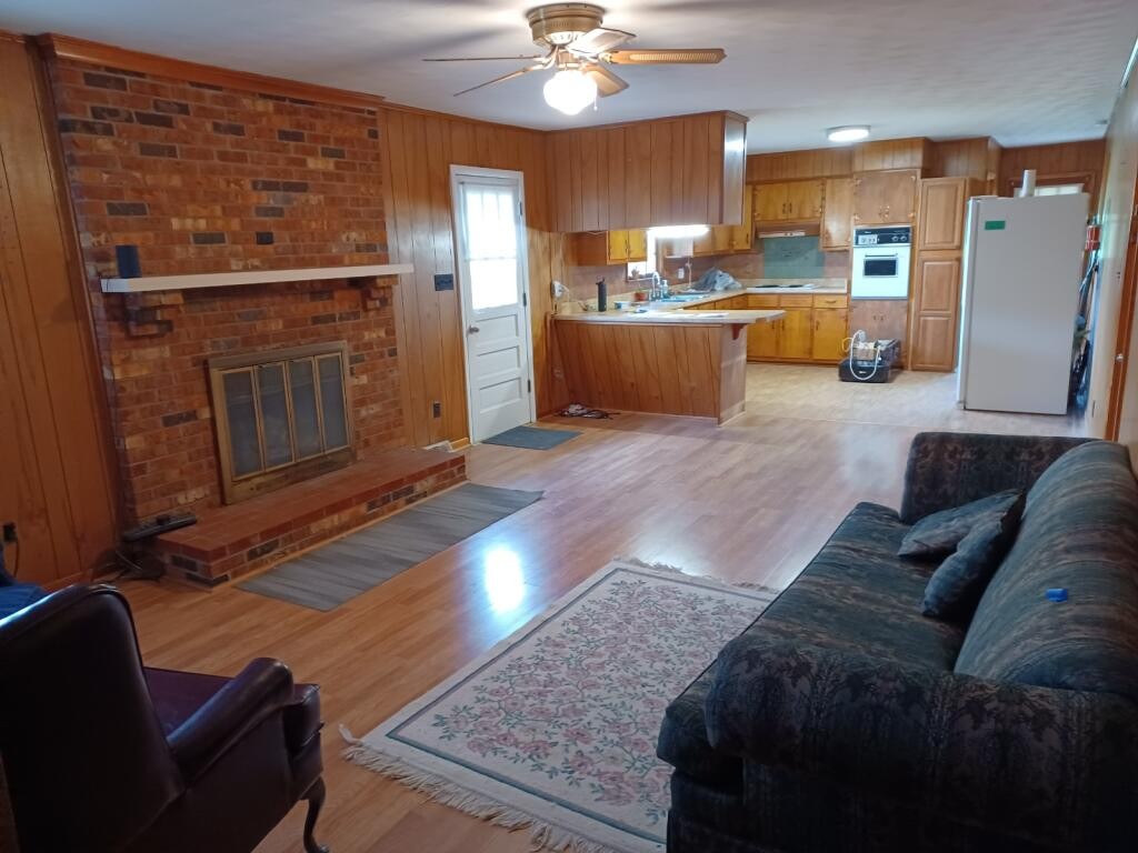 301 Lear Road Portland, TN 37148 - Photo 2 of 19 a living room with stainless steel appliances furniture a rug and a view of kitchen