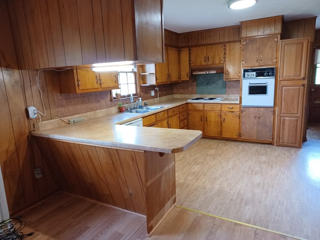 301 Lear Road Portland, TN 37148 - Photo 3 of 19 a kitchen with stainless steel appliances wooden cabinets a stove a sink and a refrigerator
