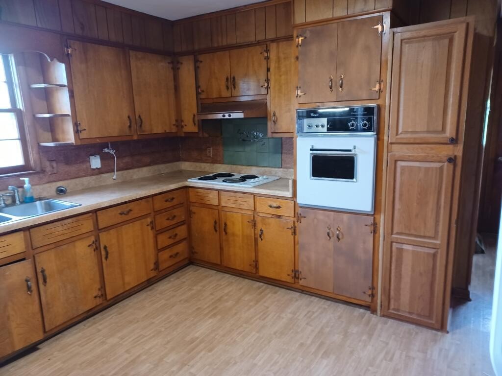 301 Lear Road Portland, TN 37148 - Photo 5 of 19 a kitchen with a refrigerator sink and cabinets