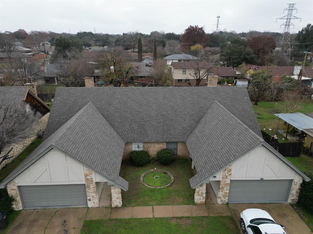 an aerial view of a house with swimming pool