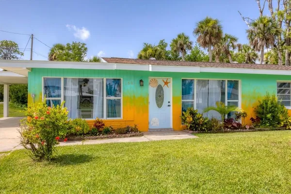 front view of a house with a yard